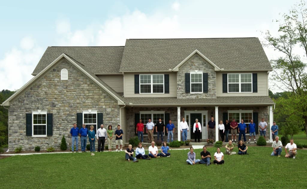 The Classic Communities team assembled in front of a finished Classic home