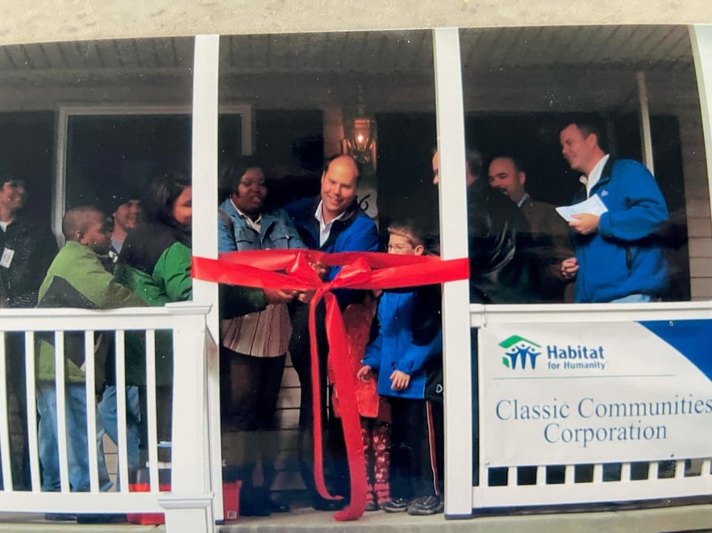 Ribbon cutting for a Habitat for Humanity home built with Classic Communities Corporation